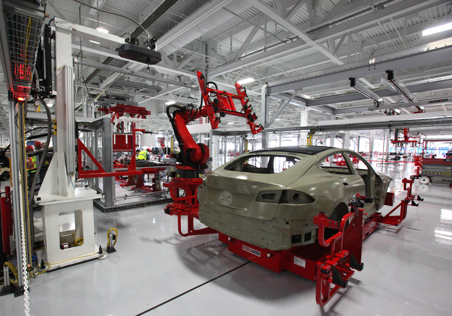 Fremont floor. S/X capacity mined for Optimus Academy — not customer sales.